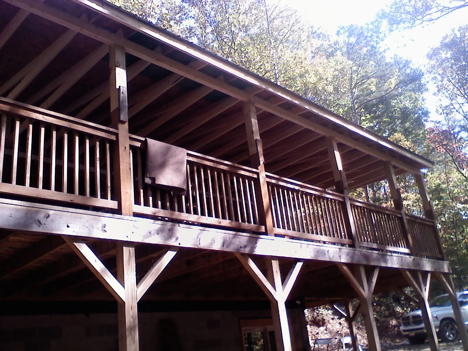 Timber framing under a new elevated porch and deck — Roof Leak Repair in New Athens by Roofing Brothers